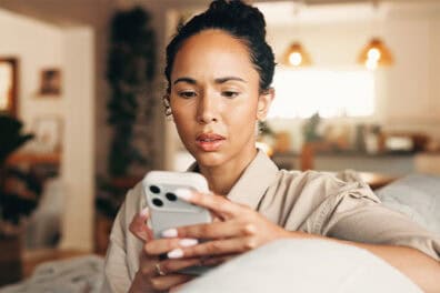 Women reading on her smart phone.