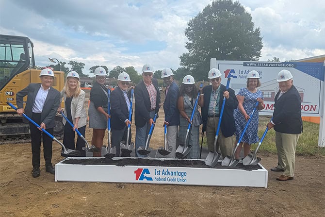 Photo from the Yorktown location groundbreaking. Group with shovels and hardhats.